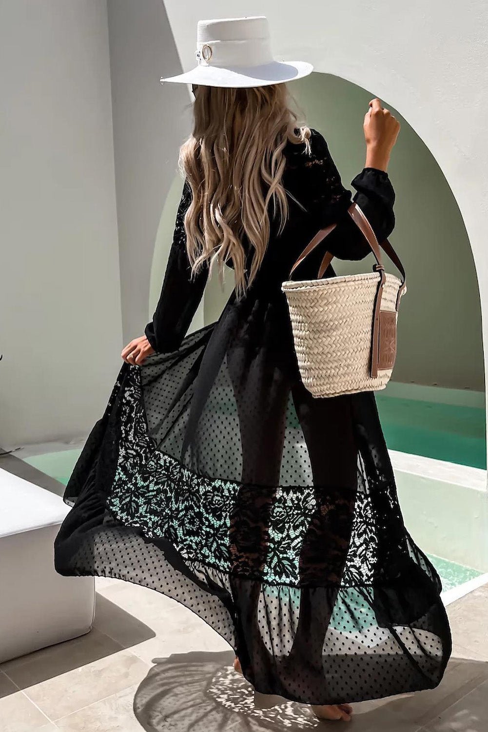 Bahia Cover-up - Kadan Swimwear the Label. This full length, flowy swimwear cover up comes in black mesh. It features long sleeves with elastic wrists, polka-dotted pattern with lace insets, and front waist tie. Perfect for that upcoming cruise or resort vacay! Limited availability.