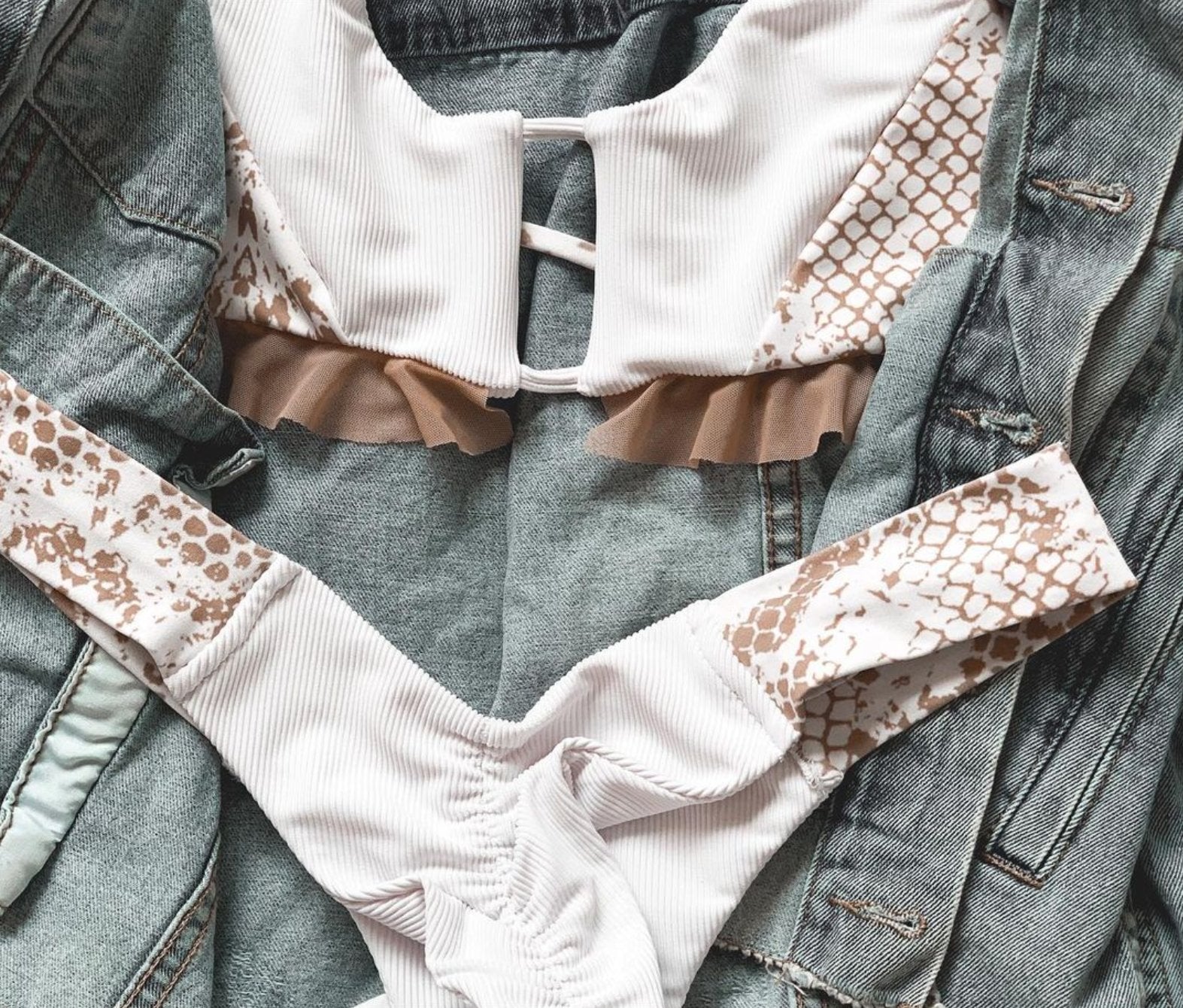 Island Berry Cheeky Bottoms - Kadan Swimwear the Label. These cheeky bikini bottoms feature a thick band that sits high up on the hips for a very flattering effect. The scrunched backside adds some allure to this swimwear bottom. Paired with elegant color and texture contrasting fabric, you can't help but notice the attention to detail with these bottoms. Pair with the Island Top and you'll feel like royalty in this bikini.