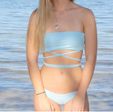 Harbor Top - Kadan Swimwear the Label. Take your favorite tube top with some body wrap strings, and voila, you have our beautiful and unique Harbor Top. Soft, comfortable, and supportive, this bikini top is perfect for the pool, days spent fishing on the water, or even paired with your favorite pants for strolling around town. Pair with our Harbor Bottoms for your new favorite bikini!